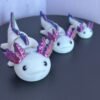 Pastel pink articulated axolotl fidget toy, 3D printed in PLA