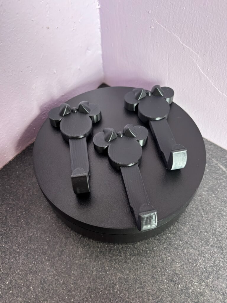 3D printed bow mouse wall hooks in black PLA