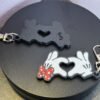 Mickey and Minnie-style 3D printed hand heart keyrings in white PLA with bow and heart detail variations