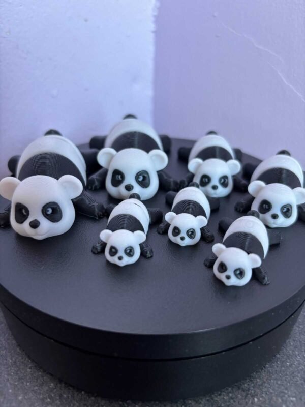 Black and white articulated panda fidget toy, 3D printed in PLA