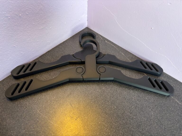 3D printed foldable coat hanger in PLA, shown in folded and open positions