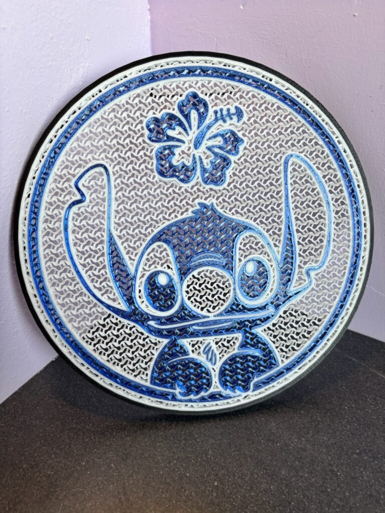 3D printed Stitch pin board with blue alien ears design for displaying enamel pins