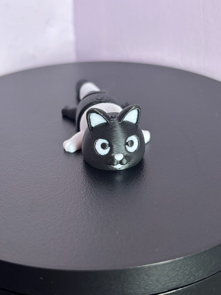 Black & White articulated cat fidget toy, 3D printed in PLA