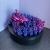 Articulated crystal dragon fidget toy in shimmering blue, 3D printed in PLA