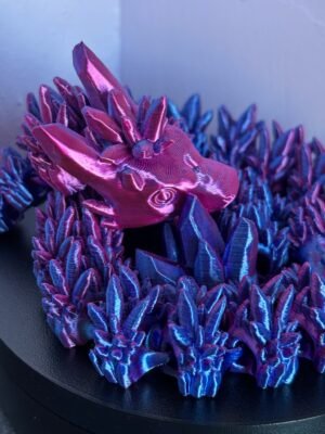 Articulated crystal dragon fidget toy in shimmering blue, 3D printed in PLA