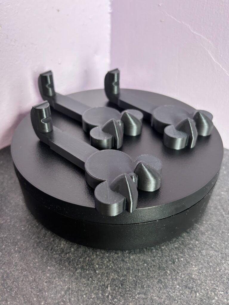3D printed bow mouse wall hooks in black PLA