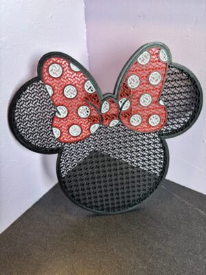 3D printed Minnie pin board with bow design in black and red PLA for displaying enamel pins