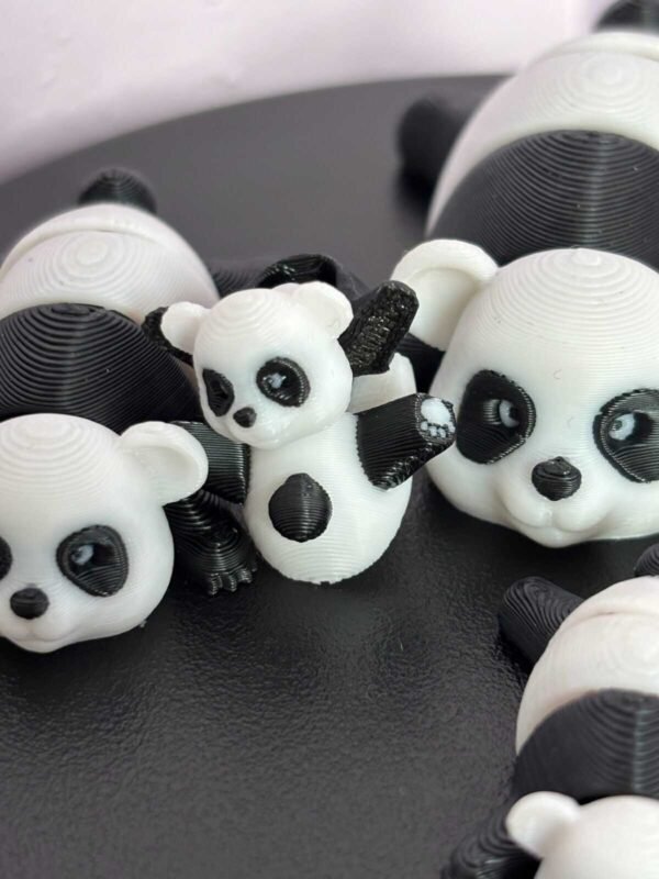 Black and white articulated panda fidget toy, 3D printed in PLA