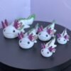 Pastel pink articulated axolotl fidget toy, 3D printed in PLA