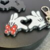 Mickey and Minnie-style 3D printed hand heart keyrings in white PLA with bow and heart detail variations
