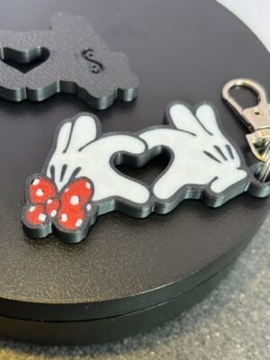 Mickey and Minnie-style 3D printed hand heart keyrings in white PLA with bow and heart detail variations