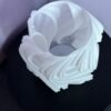 Modern swirl tea light holder with artificial candle