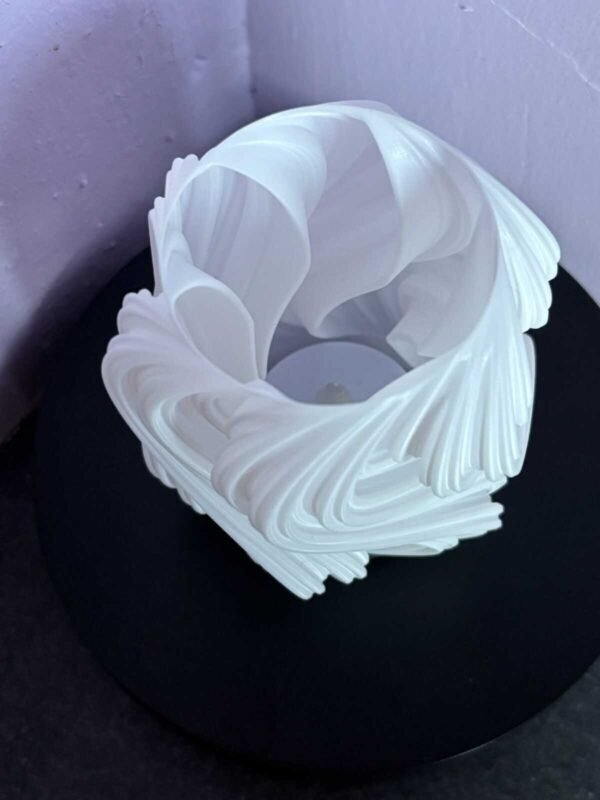 Modern swirl tea light holder with artificial candle