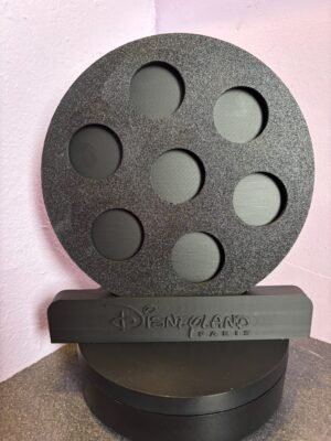 Black 3D-printed Disneyland Paris coin display stand with circular slots