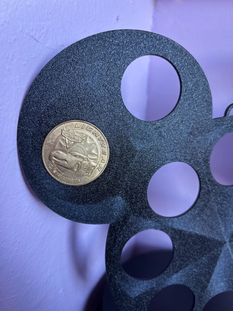 Black 3D printed coin display for Disney-style coins