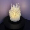 Christmas snow scene lantern glowing with flicker candle