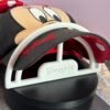 Side view of brim shaper inserted under cap visor