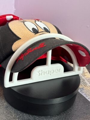 Side view of brim shaper inserted under cap visor