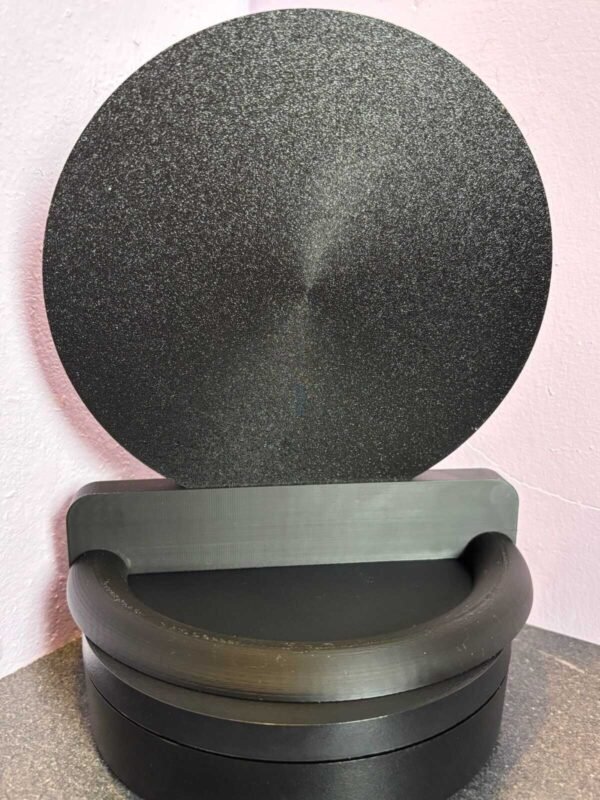 Black 3D-printed Disneyland Paris coin display stand with circular slots