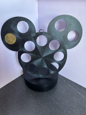 Mouse-shaped coin display with collectible coin inserted