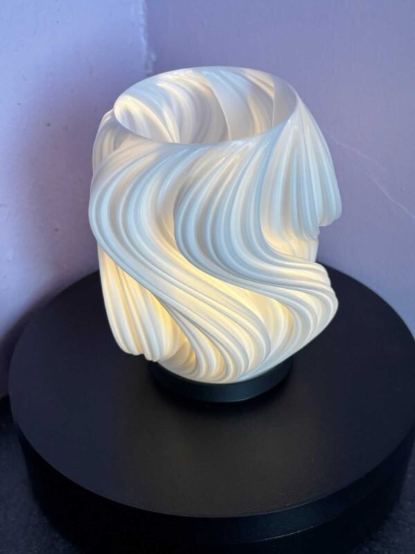 3D printed swirl tea light lantern glowing with flicker candle