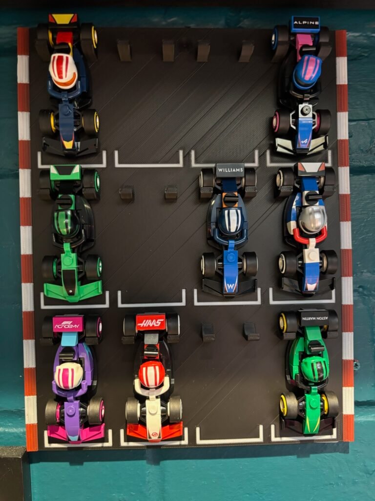LEGO Speed Champions mini F1 wall display stand holding 12 Formula One cars on a racetrack-style board