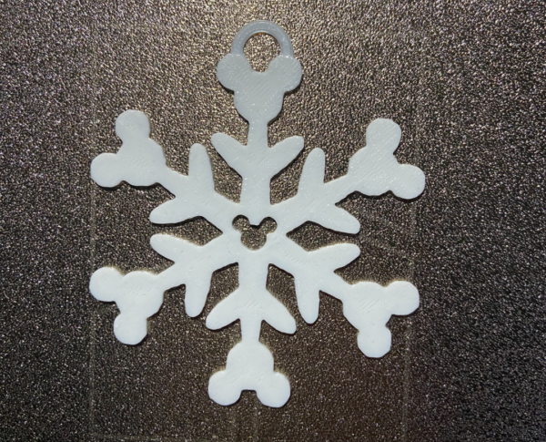 Close-up of festive mouse snowflake Christmas tree decoration