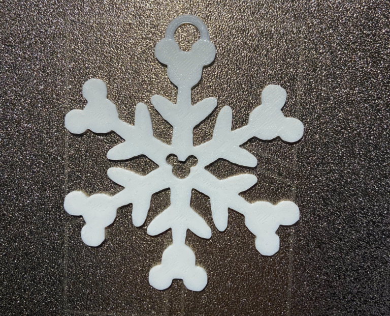 Close-up of festive mouse snowflake Christmas tree decoration