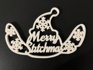 3D printed blue alien Christmas ornament with snowflakes