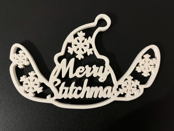 3D printed blue alien Christmas ornament with snowflakes