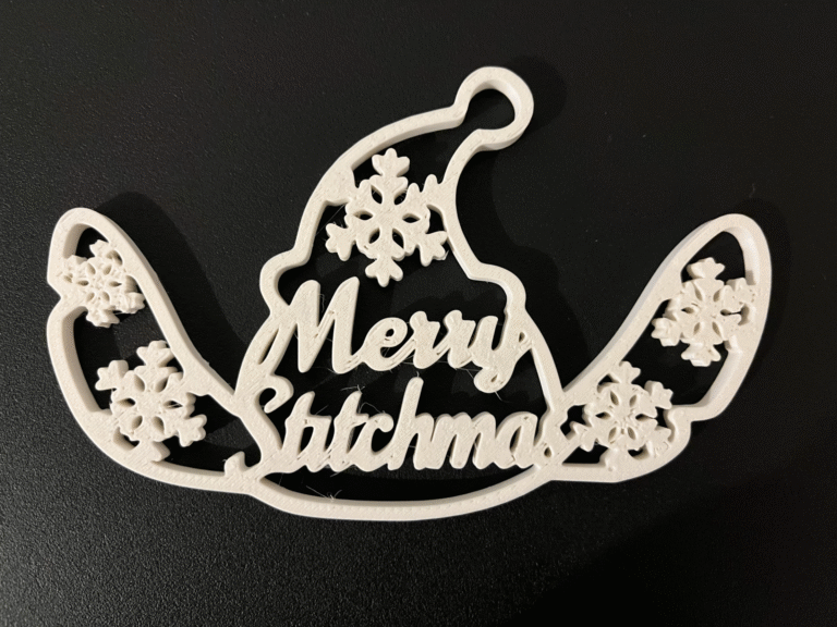 3D printed blue alien Christmas ornament with snowflakes