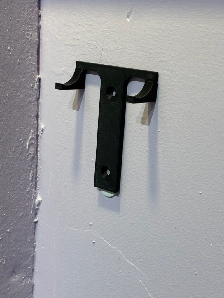 Small black wall hook for Formula 1 car display