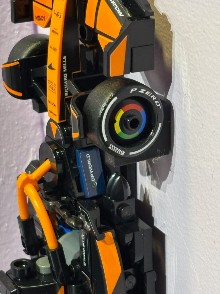 Discreet wall hook holding Formula 1 Speed Champions car