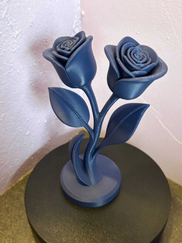 01f53bfd7cad7a7935aa2f692044fae3276550deac 3D printed rose ornament on display stand
