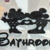 Close-up detail of 3D printed enchanted mouse couple and custom storybook text on personalised castle room sign — black PLA character on white castle background