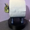 Side view of highland cow toilet roll holder holding a standard loo roll — freestanding 3D printed bathroom accessory in gold and blue PLA
