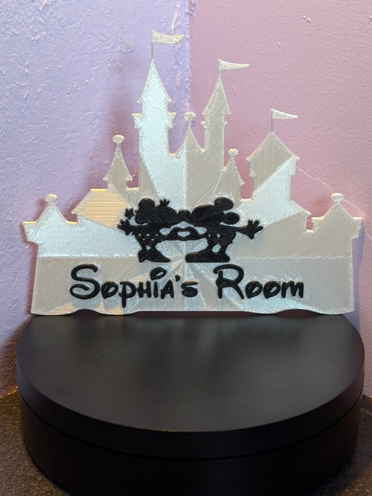 Personalised magical castle room sign reading "Sophia's Room" — white 3D printed fairytale castle silhouette with enchanted mouse couple motif and storybook font
