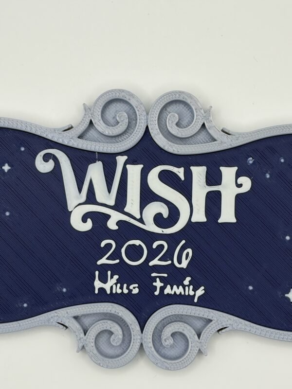 Close-up of personalised cruise ship name door plaque — enchanted ornate font ship name "Wish" with custom date and family name on deep navy starry background, silver scroll border, 3D printed UK