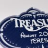 Personalised magical cruise Treasure door plaque magnet — navy blue quatrefoil shaped stateroom sign with silver ornate frame, showing ship name, date and personalised name in raised white text, UK 3D printed