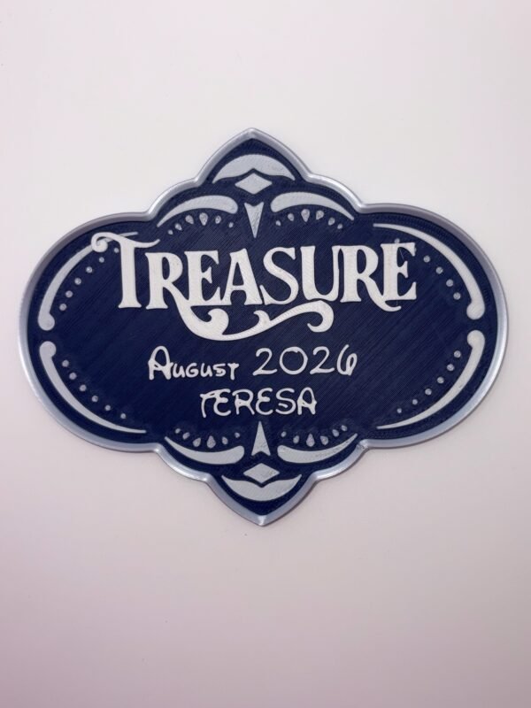 Personalised magical cruise Treasure door plaque magnet — navy blue quatrefoil shaped stateroom sign with silver ornate frame, showing ship name, date and personalised name in raised white text, UK 3D printed