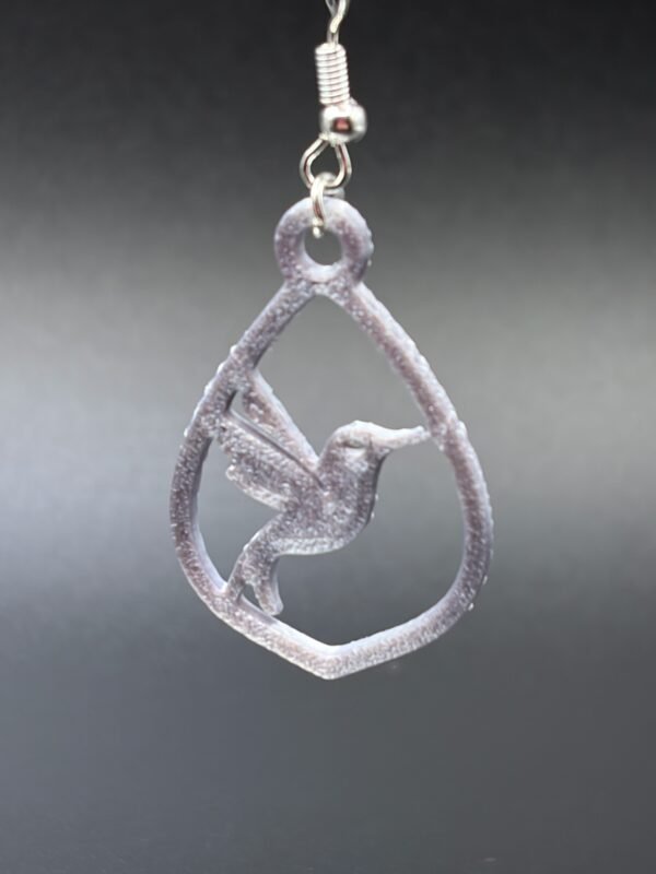 Close-up of lilac hummingbird in teardrop frame dangle earring with silver hypoallergenic hook - HulkyWears 3D printed jewellery
