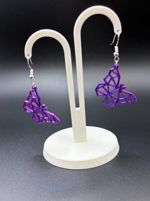 Pair of purple-blue silk geometric low-poly butterfly dangle earrings on display stand - 3D printed EcoPlastic jewellery by HulkyWears UK