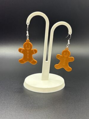 Pair of gingerbread man dangle earrings on display stand - 3D printed EcoPlastic festive Christmas jewellery by HulkyWears UK