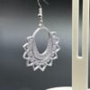 Close-up of silver mandala hoop dangle earring showing open oval hoop and filigree heart-petal fan detail - HulkyWears 3D printed jewellery
