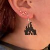 lose-up of black fairy tale magic castle dangle earring with soaring spires and silver hypoallergenic hook - HulkyWears 3D printed jewellery