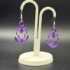 Pair of purple-blue silk Mickey anchor dangle earrings on display stand - HulkyWears 3D printed jewellery UK