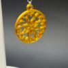 Golden yellow snowflake disc dangle earring close-up showing intricate inner lattice and round border - 3D printed EcoPlastic jewellery by HulkyWears