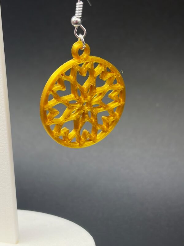 Golden yellow snowflake disc dangle earring close-up showing intricate inner lattice and round border - 3D printed EcoPlastic jewellery by HulkyWears