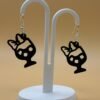 Pair of black Minnie Mouse cocktail glass dangle earrings on display stand - 3D printed Disney fan jewellery by HulkyWears UK