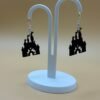 Pair of black magic castle silhouette dangle earrings on display stand - 3D printed EcoPlastic theme park jewellery by HulkyWears UK